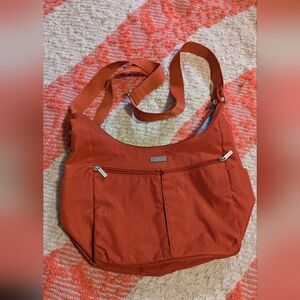 Baggallini Rust Orange Shoulder Bag. 8 X 12 Inches. Adjustable Strap. Never Used